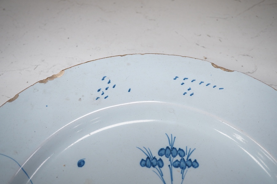 An 18th century English delftware plate, 34cm